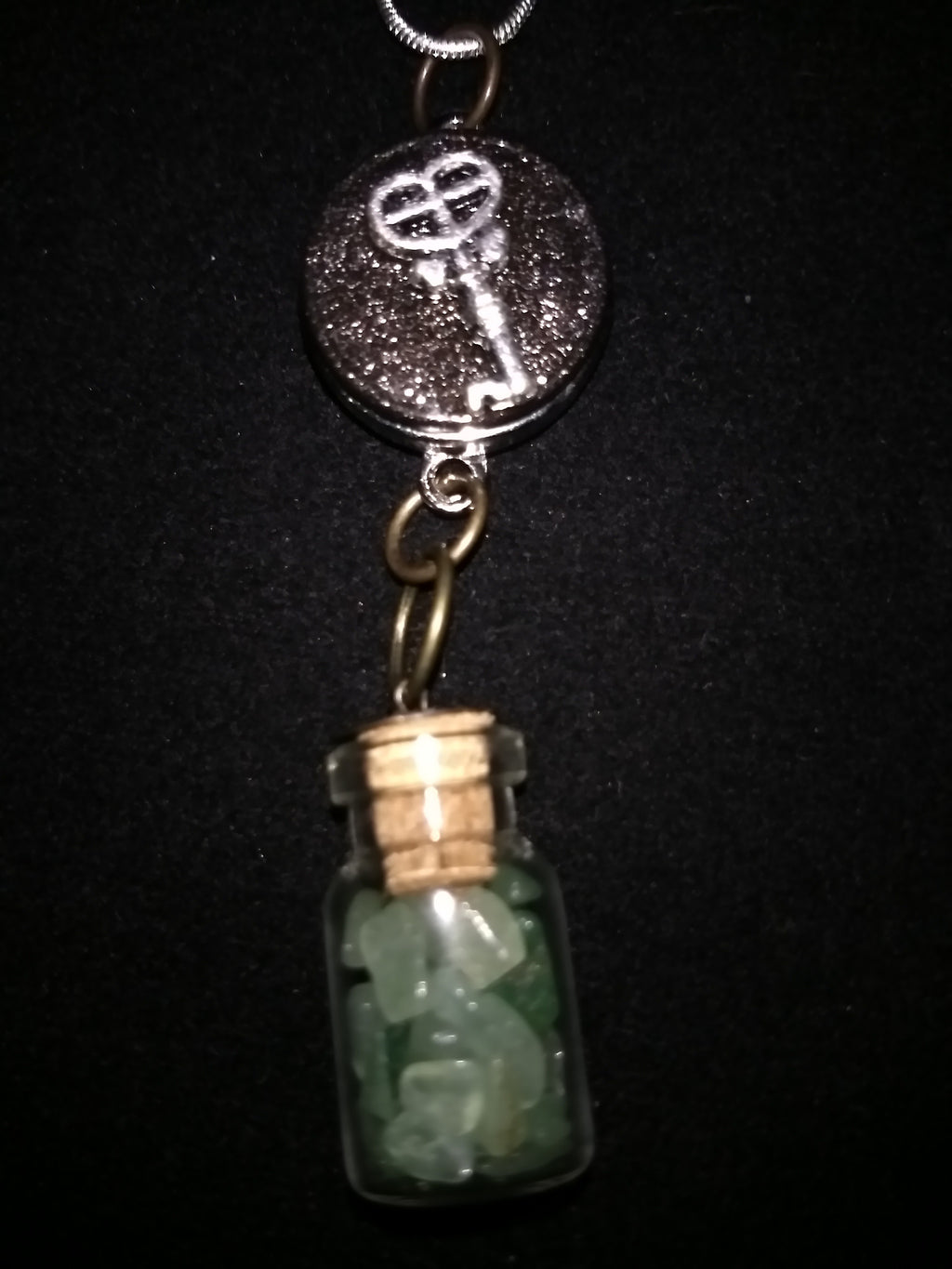 Crystals in a bottle gem necklace with removable snap